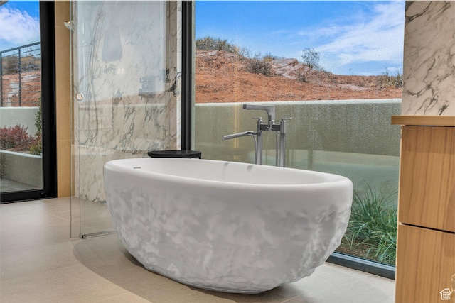 63 E Colima Rd, Washington, UT 84780 - bathroom with a soaking tub and a sink