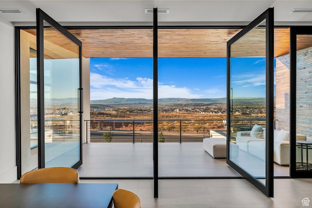 63 E Colima Rd, Washington, UT 84780 - doorway to outside with a wall of windows and a mountain view