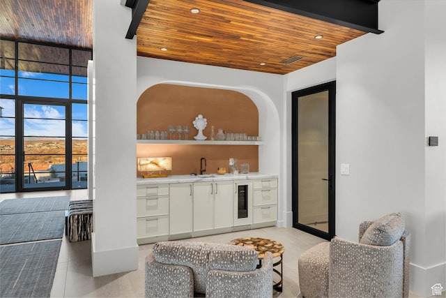 63 E Colima Rd, Washington, UT 84780 - indoor wet bar featuring wooden ceiling, beverage cooler, light tile patterned floors, and recessed lighting