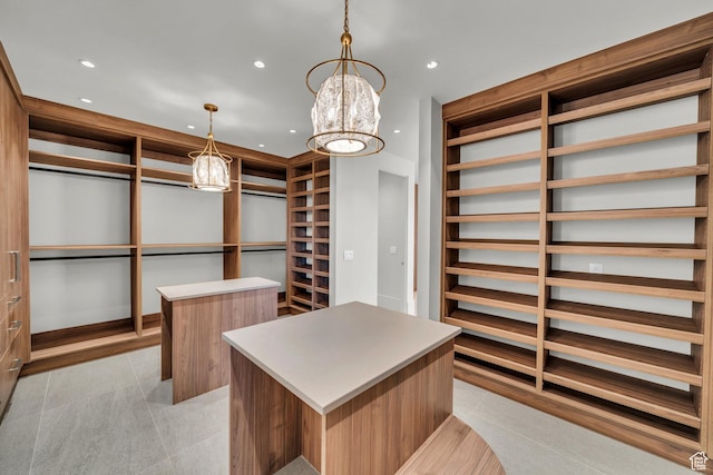 63 E Colima Rd, Washington, UT 84780 - walk in closet with light tile patterned floors and a chandelier