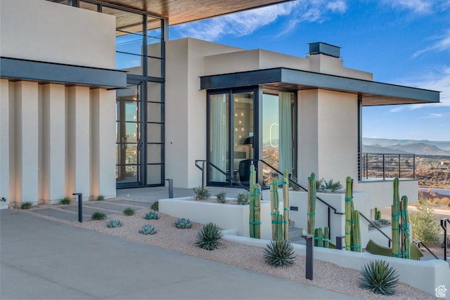 63 E Colima Rd, Washington, UT 84780 - entrance to property featuring stucco siding and a mountain view