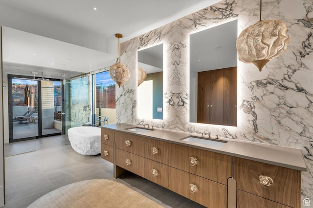 63 E Colima Rd, Washington, UT 84780 - full bath featuring double vanity, a freestanding bath, stone wall, tile walls, and an enclosed shower