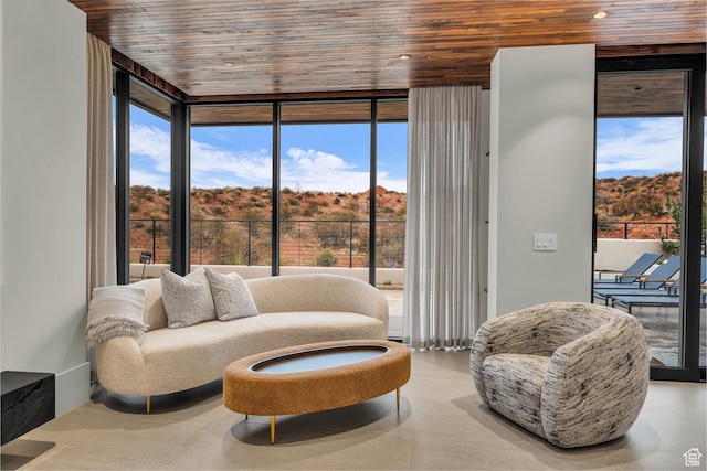 63 E Colima Rd, Washington, UT 84780 - sitting room with wooden ceiling and floor to ceiling windows