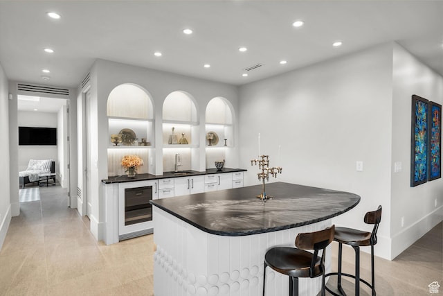 63 E Colima Rd, Washington, UT 84780 - indoor wet bar featuring wine cooler and recessed lighting