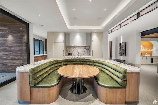 63 E Colima Rd, Washington, UT 84780 - bar area with tasteful backsplash, wall chimney range hood, and a raised ceiling