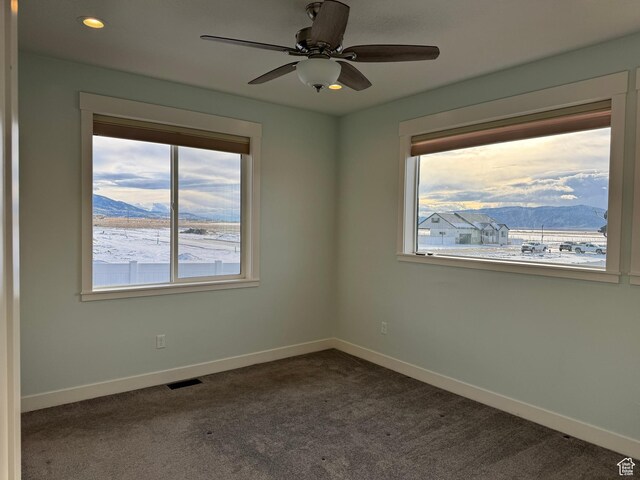 205 W 400 S, Ephraim, UT 84627 - empty room featuring baseboards, dark colored carpet, ceiling fan, a mountain view, and recessed lighting