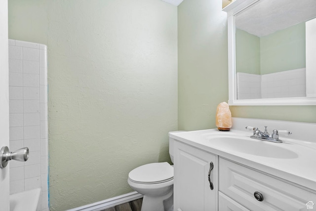 4409 S Rosehaven Ct Unit B, West Valley City, UT 84120 - full bathroom with a textured wall, toilet, and vanity