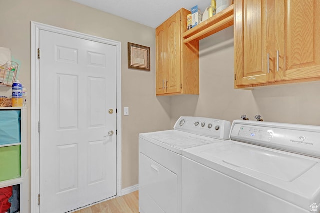 260 S 370 E, Smithfield, UT 84335 - laundry area with cabinets, washing machine and dryer, and light wood-type flooring