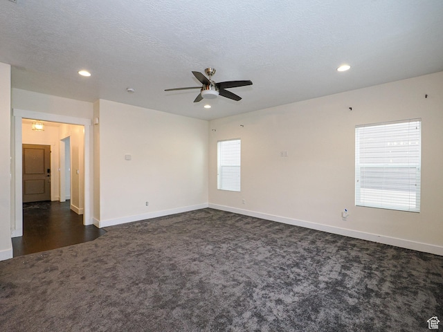 13364 S Stone Hayes Ct, Herriman, UT 84096 - unfurnished room featuring dark colored carpet, ceiling fan, and a textured ceiling