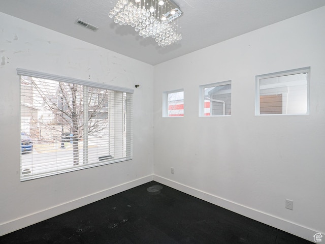 13364 S Stone Hayes Ct, Herriman, UT 84096 - empty room featuring a notable chandelier