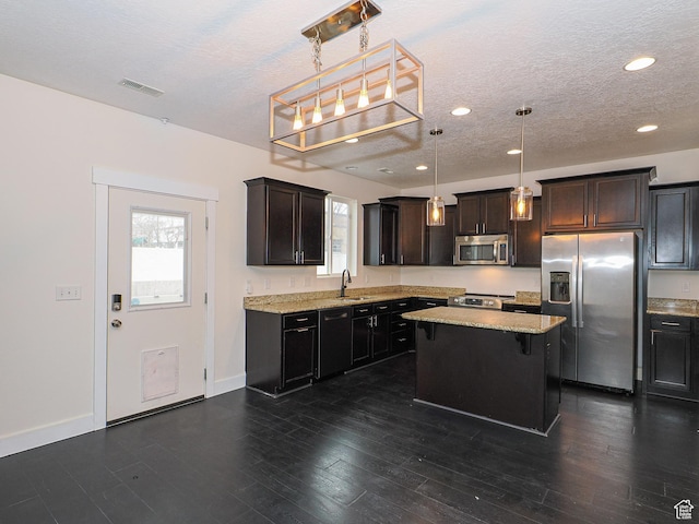 13364 S Stone Hayes Ct, Herriman, UT 84096 - kitchen with appliances with stainless steel finishes, dark hardwood / wood-style floors, pendant lighting, sink, and a center island
