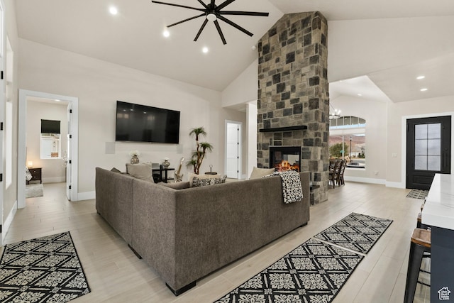 802 E Prairie Way, Washington, UT 84780 - living room with a stone fireplace, high vaulted ceiling, and light wood-type flooring