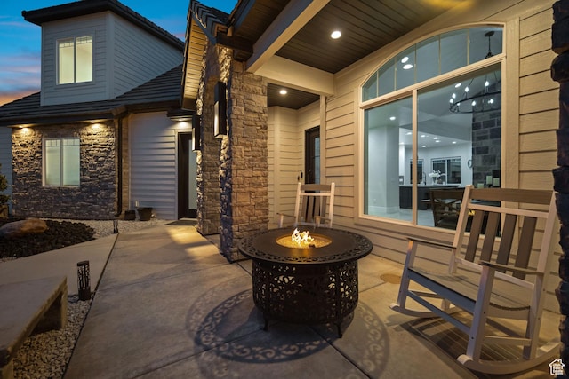 802 E Prairie Way, Washington, UT 84780 - patio terrace at dusk featuring an outdoor fire pit