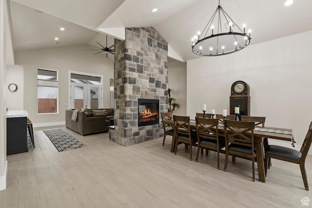802 E Prairie Way, Washington, UT 84780 - dining space with a stone fireplace, high vaulted ceiling, ceiling fan, and light hardwood / wood-style flooring