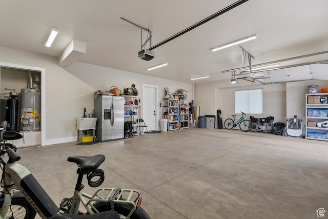 802 E Prairie Way, Washington, UT 84780 - garage featuring stainless steel fridge with ice dispenser, a garage door opener, and water heater