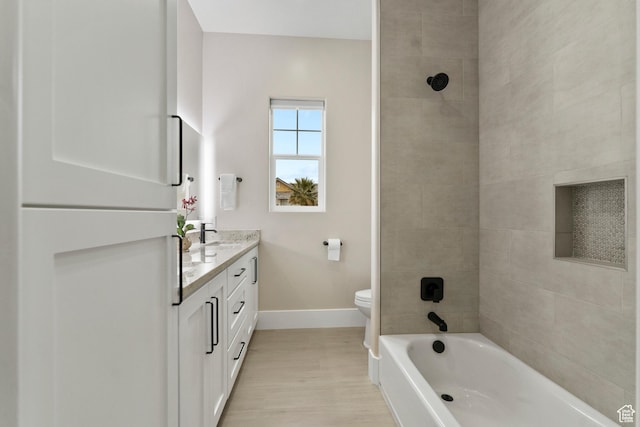 802 E Prairie Way, Washington, UT 84780 - full bathroom with hardwood / wood-style flooring, vanity, tiled shower / bath, and toilet