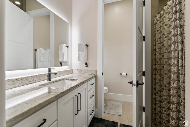 802 E Prairie Way, Washington, UT 84780 - bathroom with vanity, hardwood / wood-style floors, and toilet