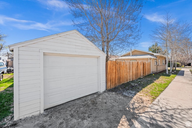 160 N Adams Ave E, Ogden, UT 84404 - detached garage featuring driveway and fence