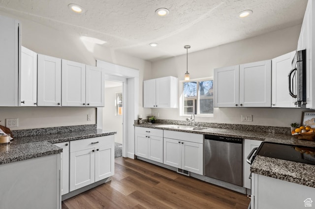 160 N Adams Ave E, Ogden, UT 84404 - kitchen featuring a sink, pendant lighting, white cabinetry, appliances with stainless steel finishes, and recessed lighting