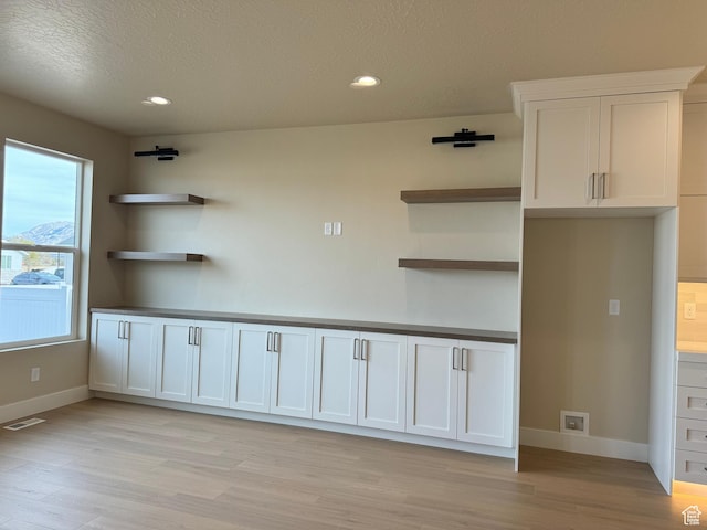 1273 W Hendrix St Unit 145, Riverton, UT 84065 - interior space with a textured ceiling and light hardwood / wood-style flooring