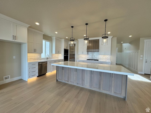 1273 W Hendrix St Unit 145, Riverton, UT 84065 - kitchen featuring decorative light fixtures, dishwasher, white cabinets, a large island, and custom range hood