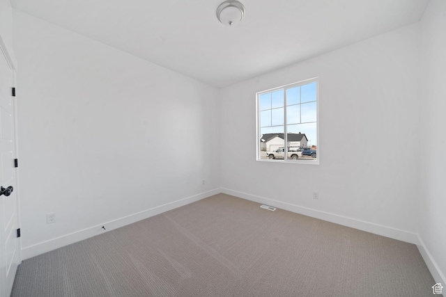 unfurnished room featuring carpet floors