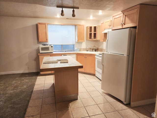 8298 S Arlington Ct, West Jordan, UT 84088 - kitchen with light brown cabinetry, white appliances, a textured ceiling, and a kitchen island