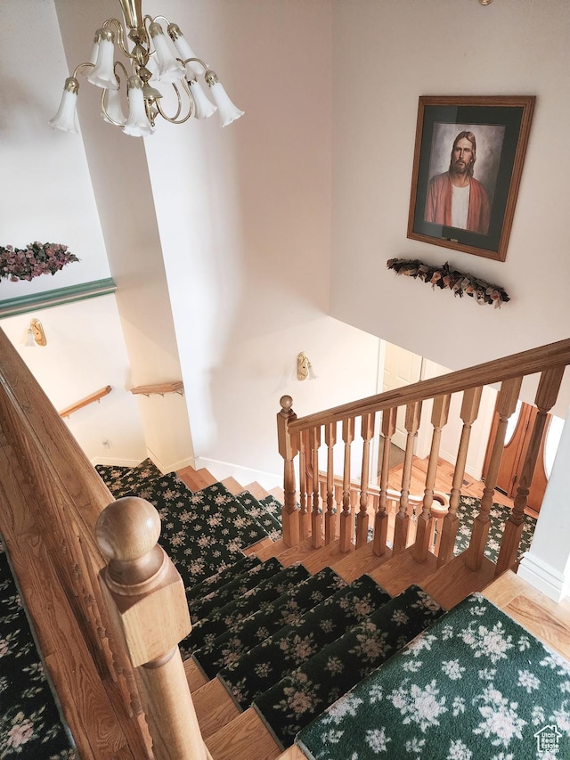 8298 S Arlington Ct, West Jordan, UT 84088 - staircase with a chandelier