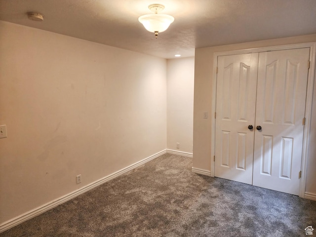 8298 S Arlington Ct, West Jordan, UT 84088 - unfurnished bedroom featuring dark carpet and a closet