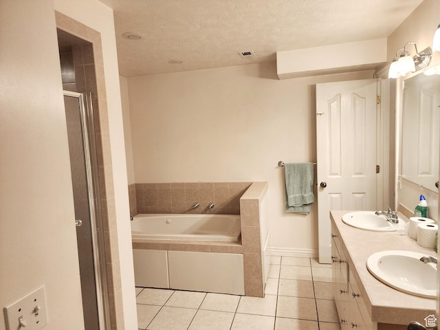 8298 S Arlington Ct, West Jordan, UT 84088 - bathroom with vanity, tile patterned floors, independent shower and bath, and a textured ceiling
