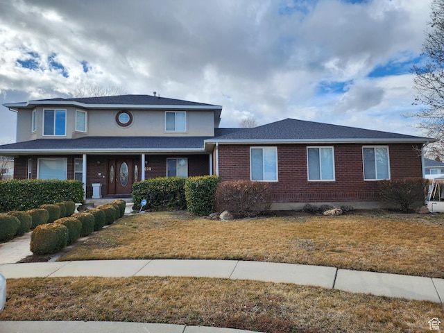 view of front of property with a front lawn