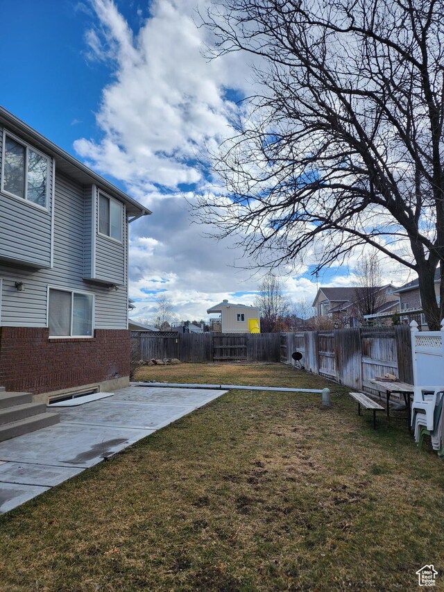 8298 S Arlington Ct, West Jordan, UT 84088 - view of yard featuring a patio area