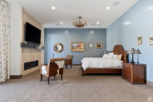 2015 S Pinnacle Cir, St George, UT 84790 - carpeted bedroom featuring a tiled fireplace and a notable chandelier