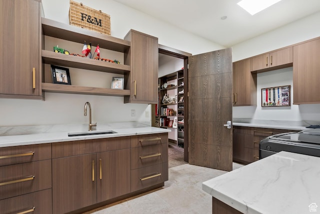 2015 S Pinnacle Cir, St George, UT 84790 - kitchen with stove, sink, and light stone countertops