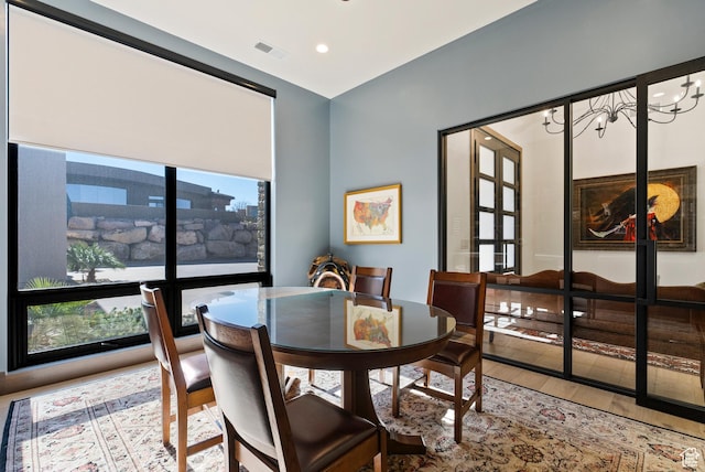 2015 S Pinnacle Cir, St George, UT 84790 - dining area featuring a notable chandelier, wood-type flooring, and french doors