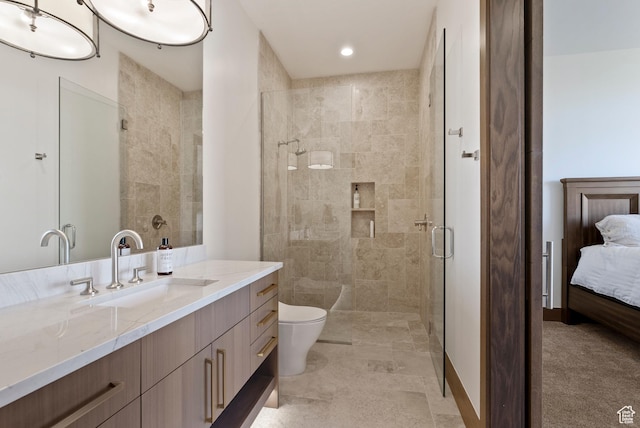 2015 S Pinnacle Cir, St George, UT 84790 - bathroom featuring walk in shower, vanity, and toilet