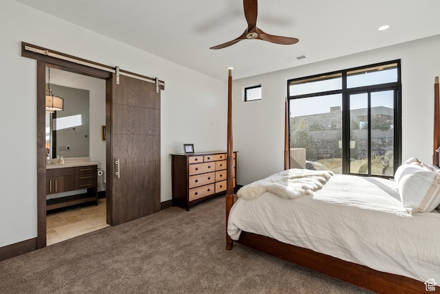 2015 S Pinnacle Cir, St George, UT 84790 - bedroom featuring ceiling fan, a barn door, carpet flooring, and ensuite bath