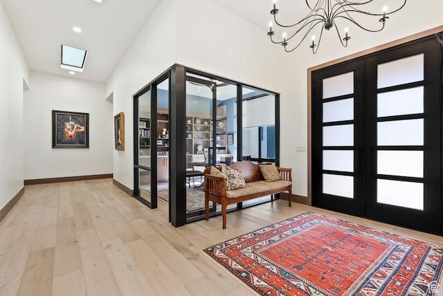 2015 S Pinnacle Cir, St George, UT 84790 - foyer entrance featuring a notable chandelier, french doors, and light wood-type flooring