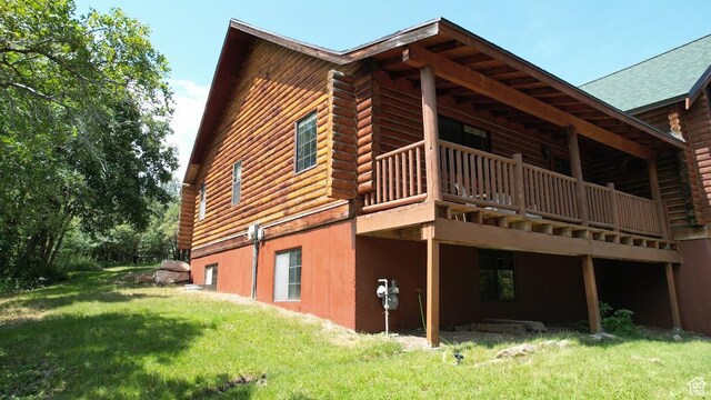 485 S Woodland Hills Dr, Woodland Hills, UT 84653 - view of side of property with a yard, a wooden deck, log siding, and a shingled roof