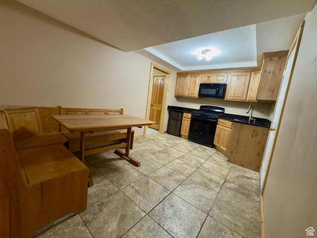 485 S Woodland Hills Dr, Woodland Hills, UT 84653 - kitchen with black appliances, dark countertops, light brown cabinetry, a raised ceiling, and a sink