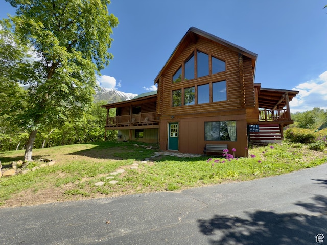 485 S Woodland Hills Dr, Woodland Hills, UT 84653 - back of house with log exterior, a wooden deck, stairway, and a lawn
