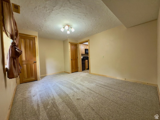 485 S Woodland Hills Dr, Woodland Hills, UT 84653 - spare room with light carpet, baseboards, and a textured ceiling