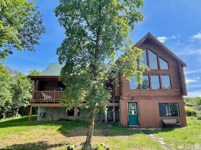 485 S Woodland Hills Dr, Woodland Hills, UT 84653 - back of property featuring log exterior, a lawn, and a wooden deck