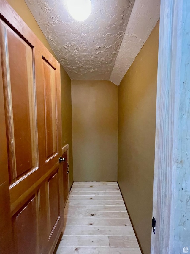 485 S Woodland Hills Dr, Woodland Hills, UT 84653 - hallway featuring a textured ceiling, light wood-type flooring, and lofted ceiling