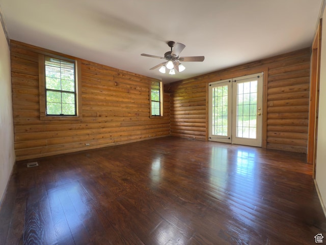 485 S Woodland Hills Dr, Woodland Hills, UT 84653 - empty room with a ceiling fan, dark wood-style flooring, and log walls