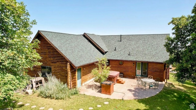 485 S Woodland Hills Dr, Woodland Hills, UT 84653 - back of house with a hot tub, a patio area, log siding, and a yard