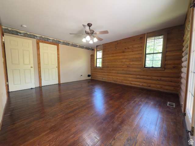 485 S Woodland Hills Dr, Woodland Hills, UT 84653 - spare room featuring dark wood finished floors, log walls, a ceiling fan, and a smoke detector