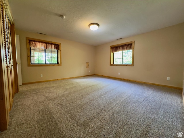 485 S Woodland Hills Dr, Woodland Hills, UT 84653 - carpeted spare room featuring baseboards, a smoke detector, and a textured ceiling
