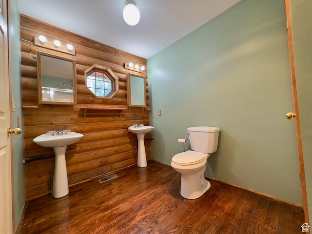 485 S Woodland Hills Dr, Woodland Hills, UT 84653 - bathroom featuring log walls, wood finished floors, a sink, and toilet