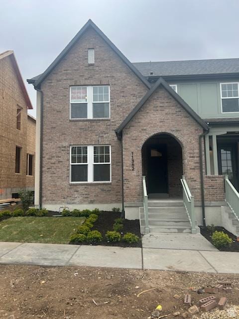view of front of home featuring brick siding